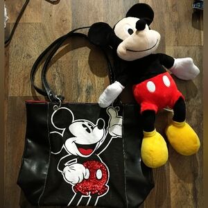 new Mickey Mouse tote bag with a large Mickey Mouse plush in perfect condition